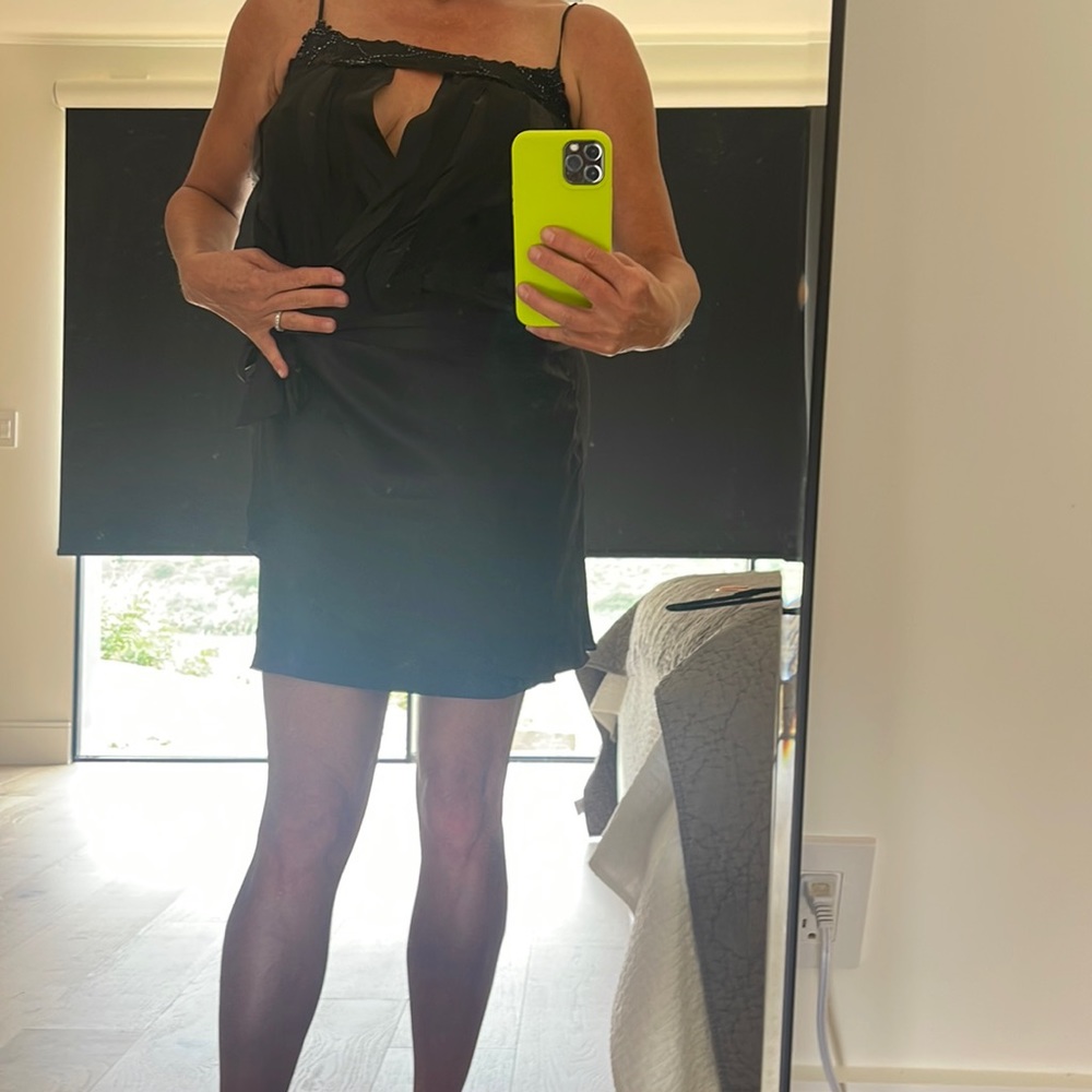 Silk wrap dress. Tie at waist. Lace trim at top with beading and front cutout.